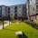 outdoor game yard with cornhole and hammocks 