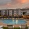 lounge chairs surrounding the Aventon Nora apartment community swimming pool 