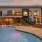 Aventon Nora's pool and club lounge at dusk